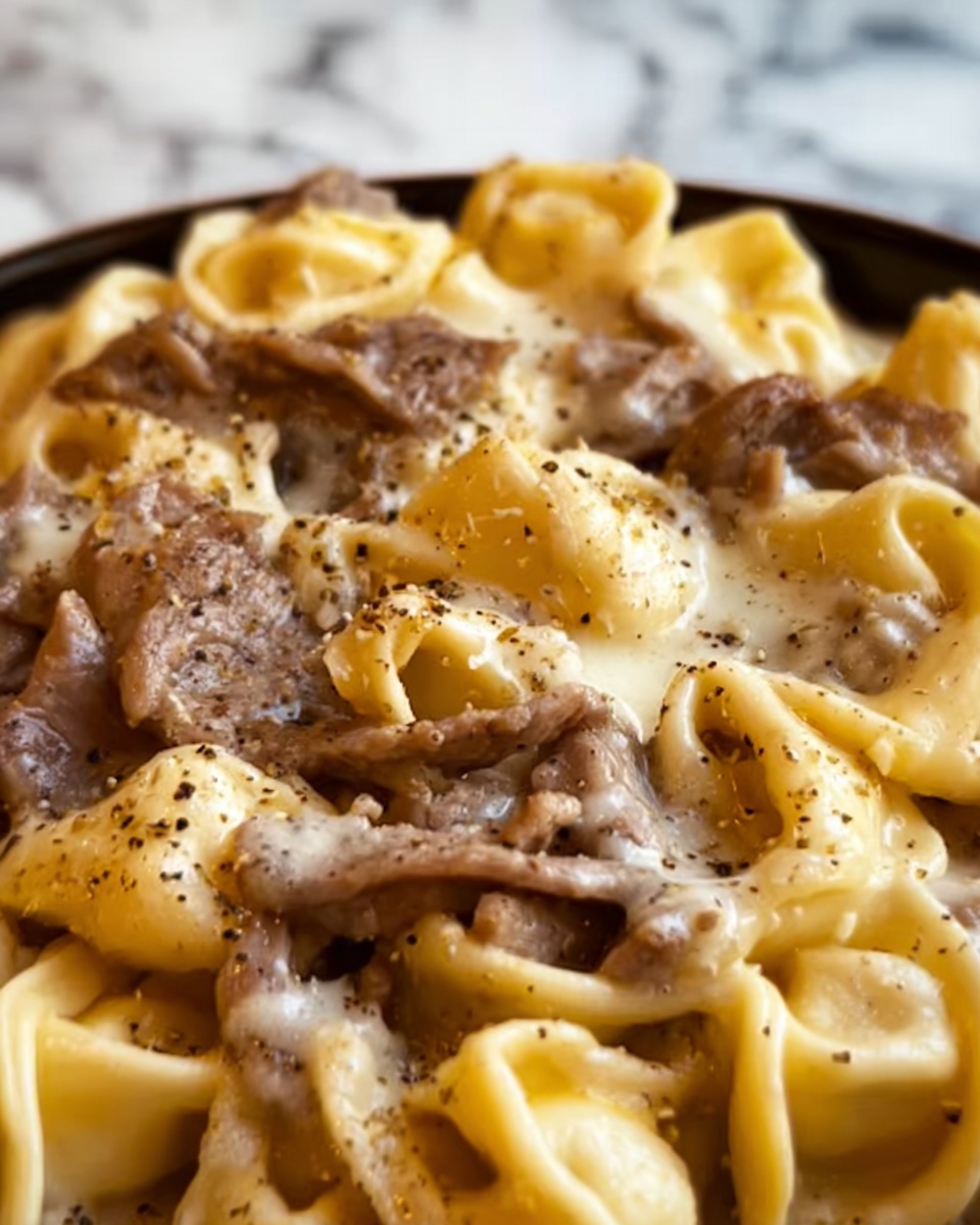 Cheesesteak Tortellini in Rich Provolone Sauce Recipe - Recipe Image