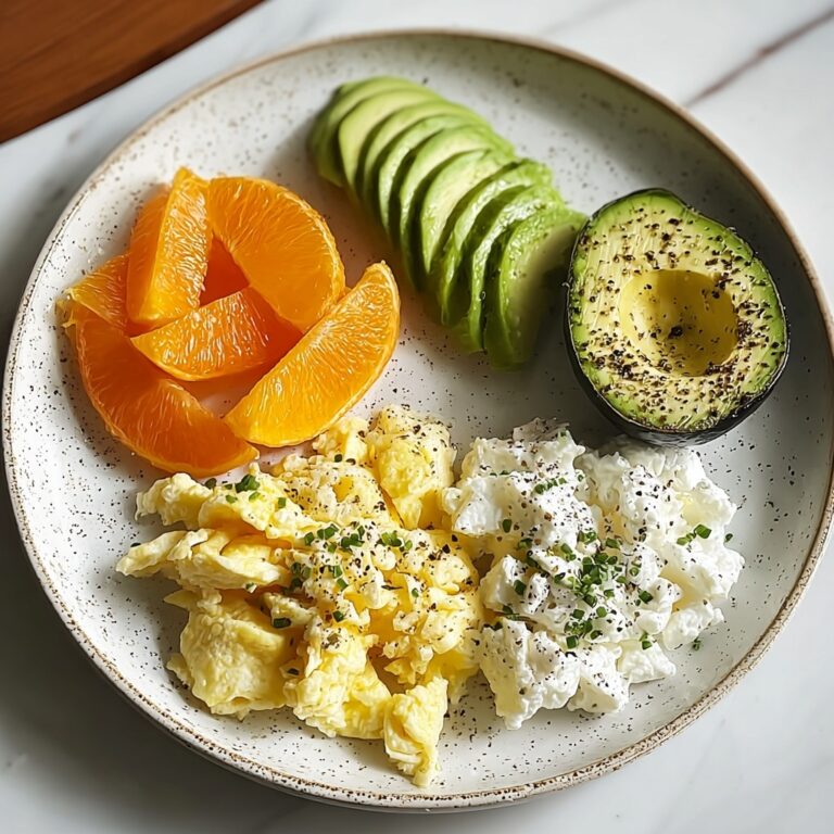 Avocado, Scrambled Eggs & Cottage Cheese Plate with Fresh Orange Recipe